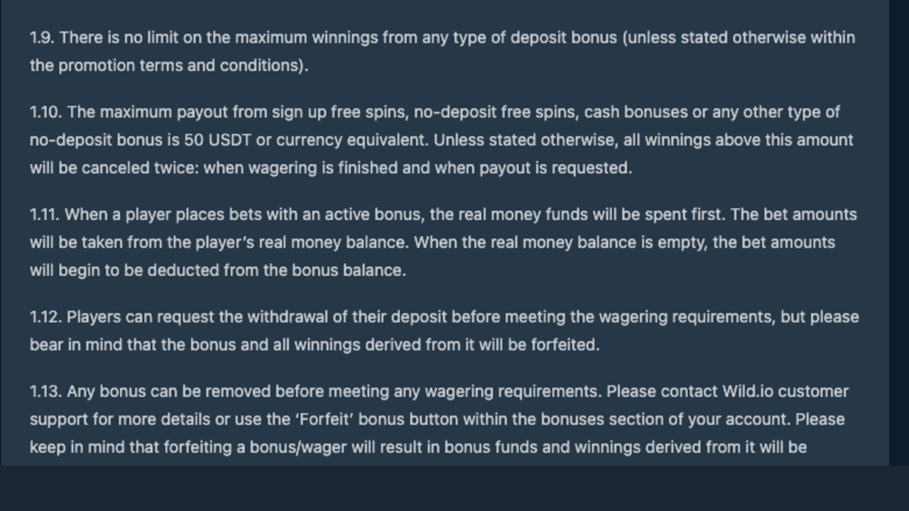 Screenshot of Wild.io bonus terms clause 1.9 stating there is no limit on the maximum winnings from any type of deposit bonus, and clause 1.10 stating the maximum payout from no-deposit bonuses is 50 USDT or currency equivalent and that winnings above it will be cancelled twice, when wagering is finished and when payout is requested