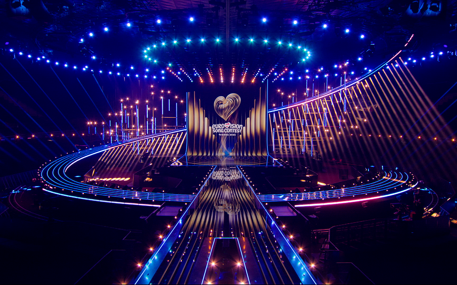 Eurovision 2026 Vienna stage reveal — the official Wiener Stadthalle production with the ESC heart logo and signature blue lighting